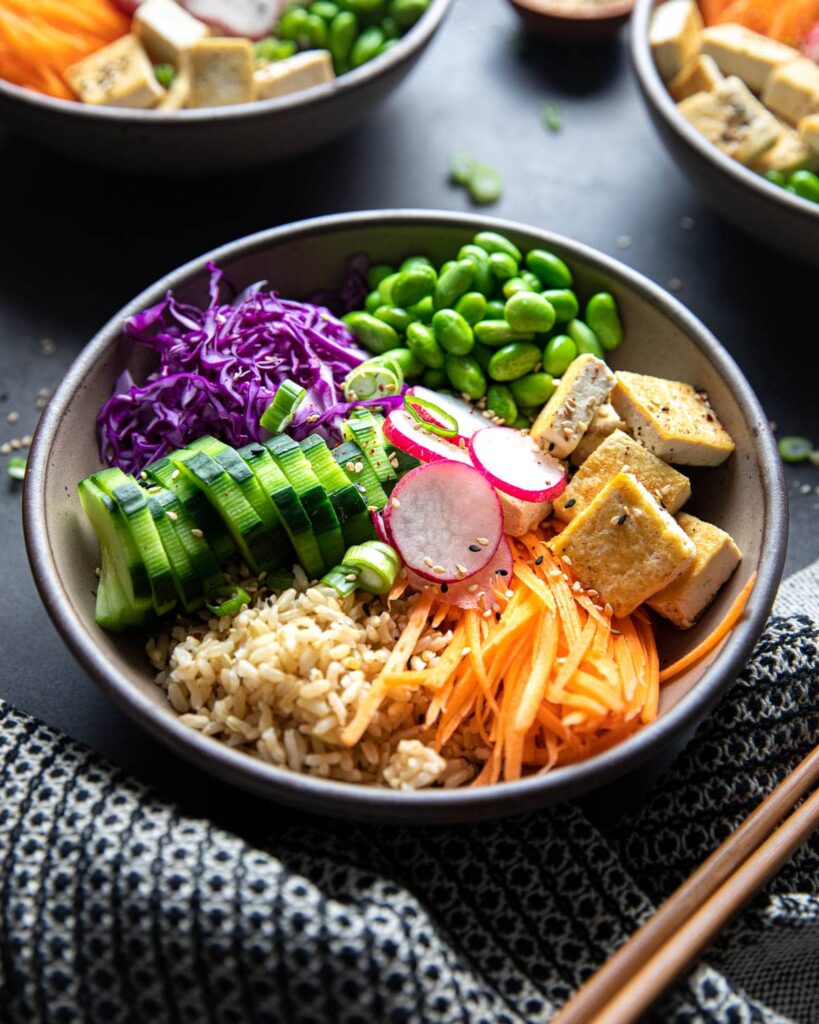 loaded plant-based poke bowl with chopsticks